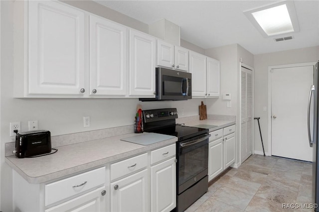 kitchen featuring white cabinetry and appliances with stainless steel finishes