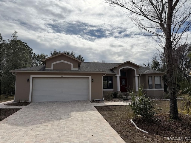 ranch-style home featuring a garage