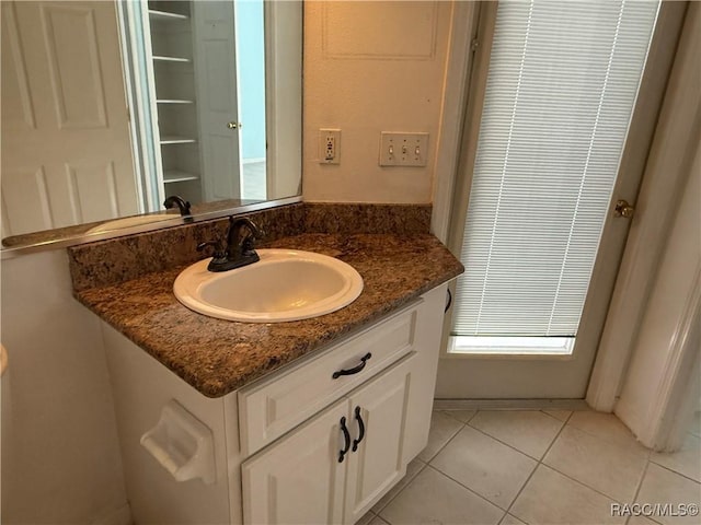 bathroom featuring vanity and tile patterned flooring