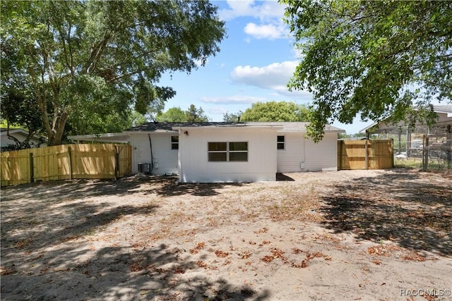 back of property featuring fence