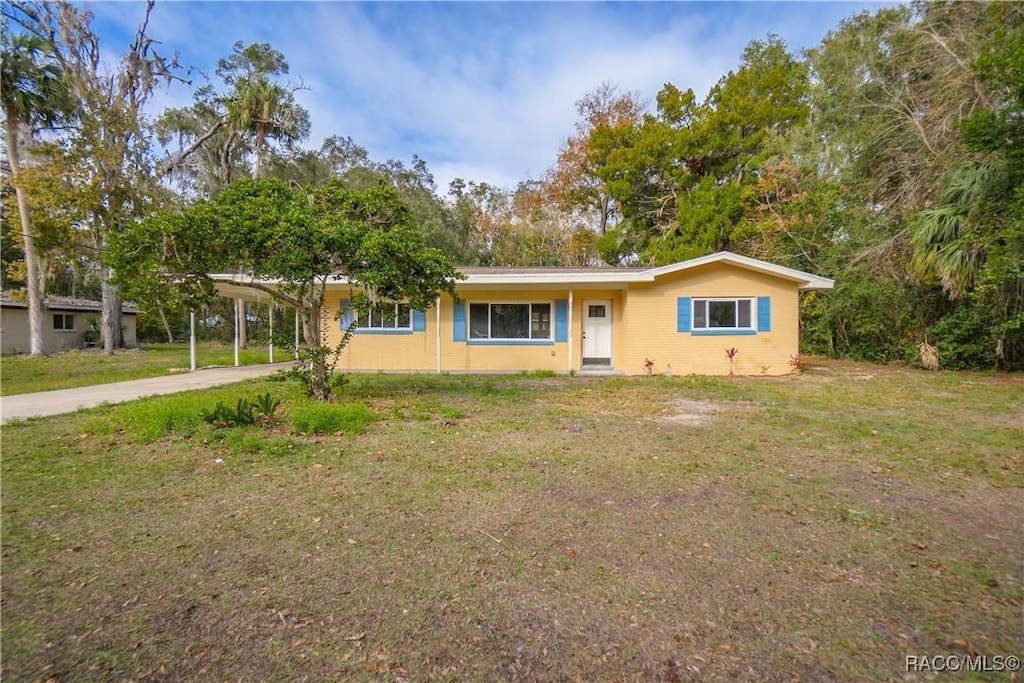 ranch-style house with a front lawn