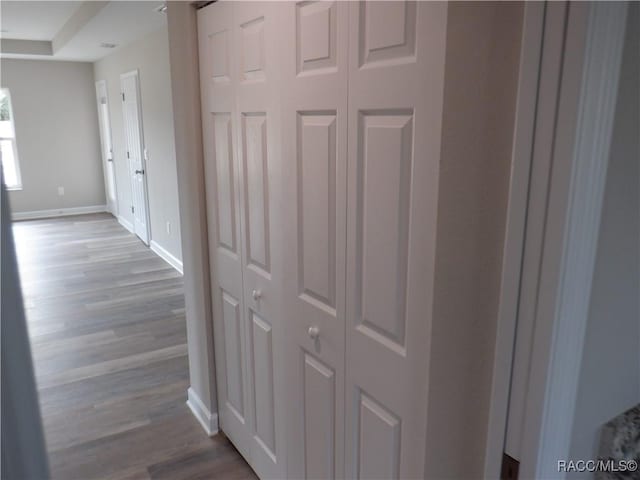 corridor with light wood-type flooring