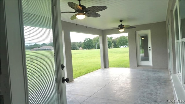 view of patio featuring ceiling fan