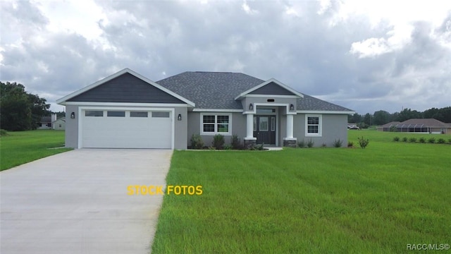 view of front facade with a garage and a front lawn