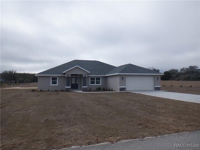 ranch-style house featuring a garage