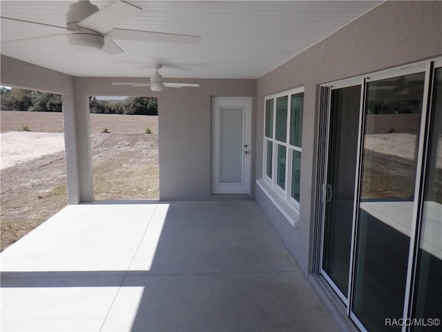 view of patio featuring ceiling fan