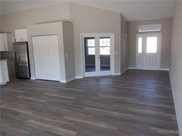 foyer featuring dark wood-type flooring and french doors