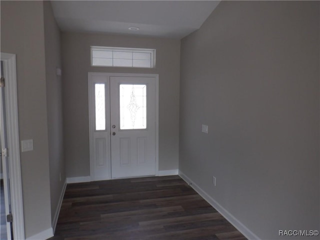 foyer with dark hardwood / wood-style floors