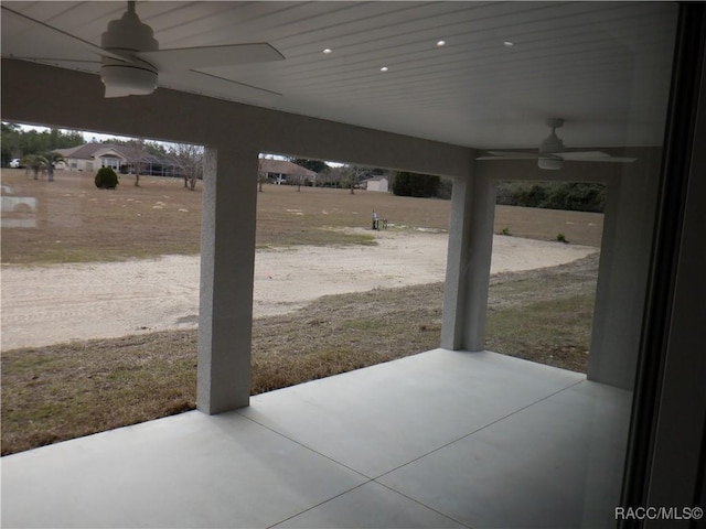 view of patio featuring ceiling fan