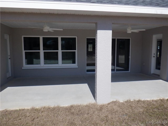 view of patio featuring ceiling fan