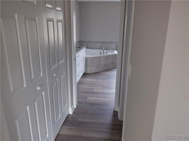 hallway with dark wood-type flooring