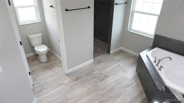 bathroom with separate shower and tub and toilet