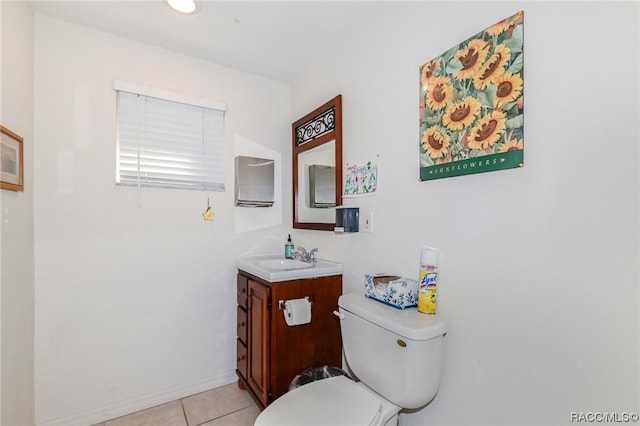 bathroom featuring tile patterned floors, vanity, and toilet