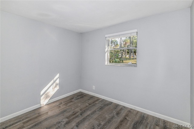 empty room featuring dark wood-type flooring