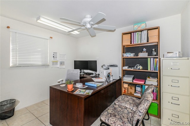 tiled office space featuring ceiling fan