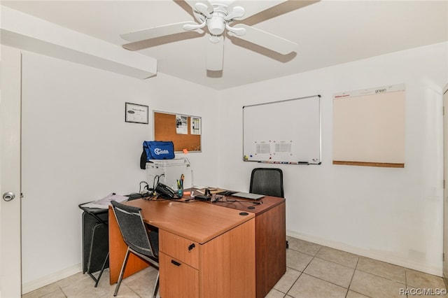 home office featuring light tile patterned floors and ceiling fan