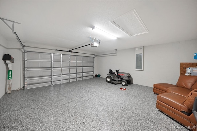 garage featuring a garage door opener and electric panel