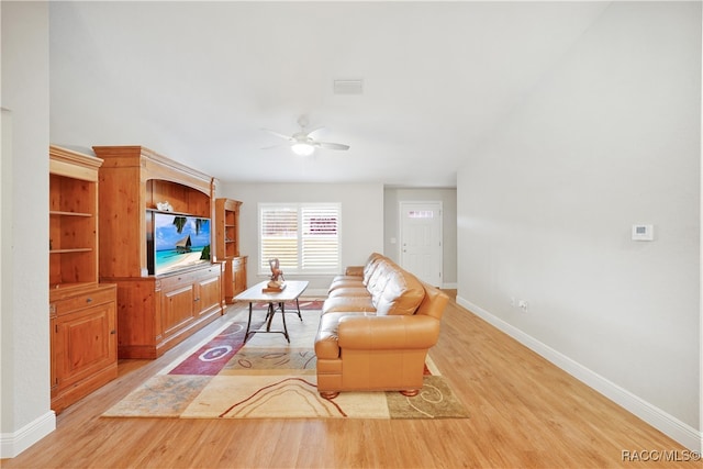 living room featuring ceiling fan and light wood-type flooring