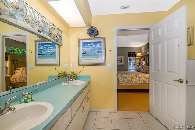 bathroom featuring tile patterned floors and vanity