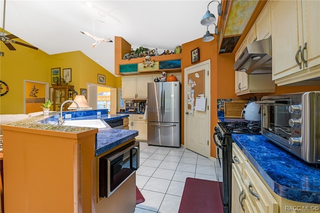 kitchen with lofted ceiling, ventilation hood, sink, light tile patterned floors, and stainless steel appliances