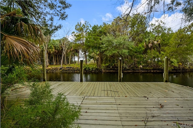 view of dock featuring a deck with water view