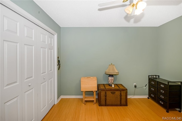 interior space with light hardwood / wood-style flooring and ceiling fan