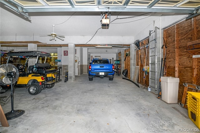 garage featuring ceiling fan and a garage door opener