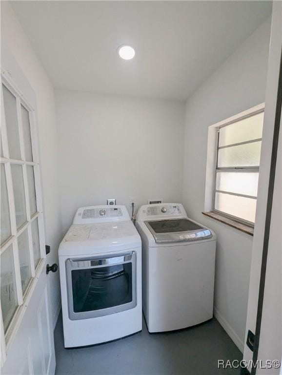 washroom featuring washing machine and dryer