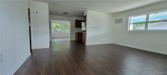 empty room with dark hardwood / wood-style floors