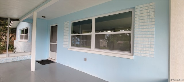 doorway to property with covered porch