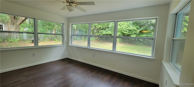 unfurnished sunroom featuring ceiling fan and plenty of natural light