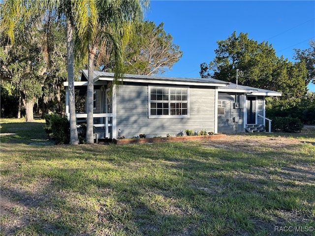 view of property exterior featuring a lawn