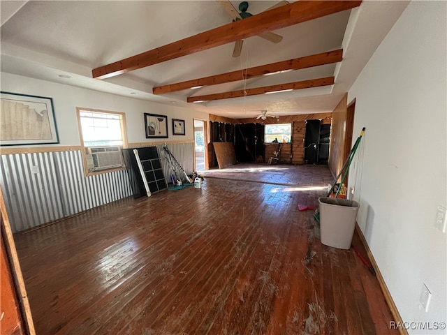 unfurnished living room featuring ceiling fan, beamed ceiling, cooling unit, and dark hardwood / wood-style floors