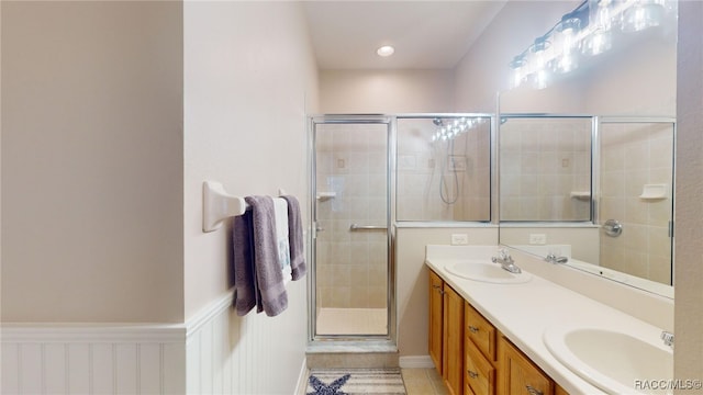 bathroom with vanity, tile patterned floors, and walk in shower