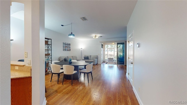 dining room with hardwood / wood-style floors