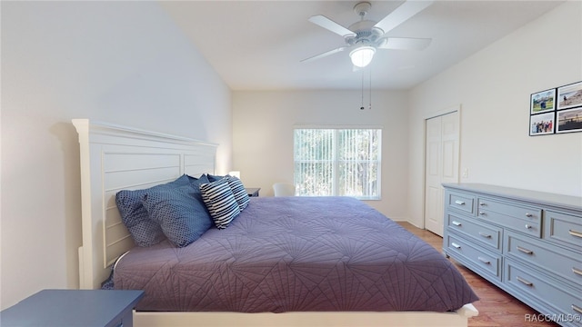 bedroom with ceiling fan and light hardwood / wood-style floors