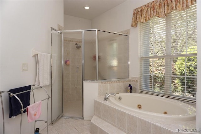 full bath featuring a stall shower, tile patterned flooring, and a whirlpool tub