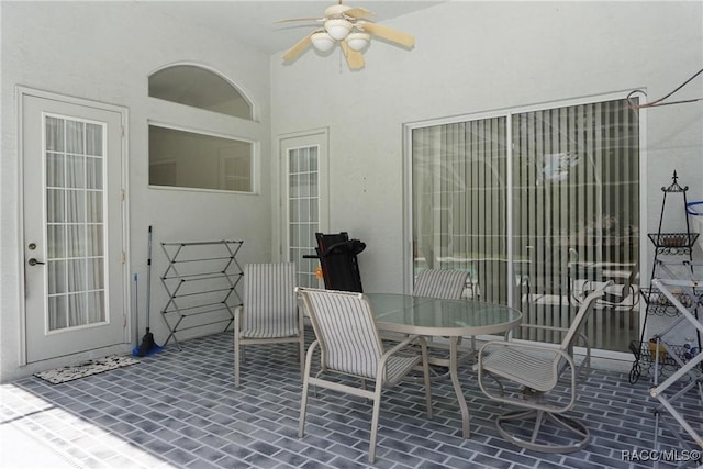 view of patio / terrace featuring a ceiling fan and outdoor dining area
