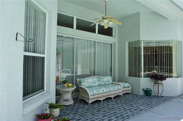 view of patio featuring ceiling fan