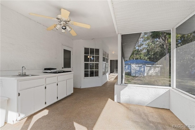 unfurnished sunroom featuring a sink