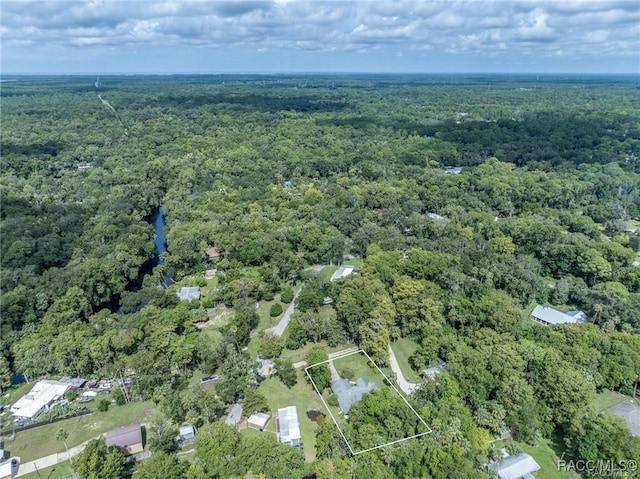 view of property location featuring a forest and property parcel outlined