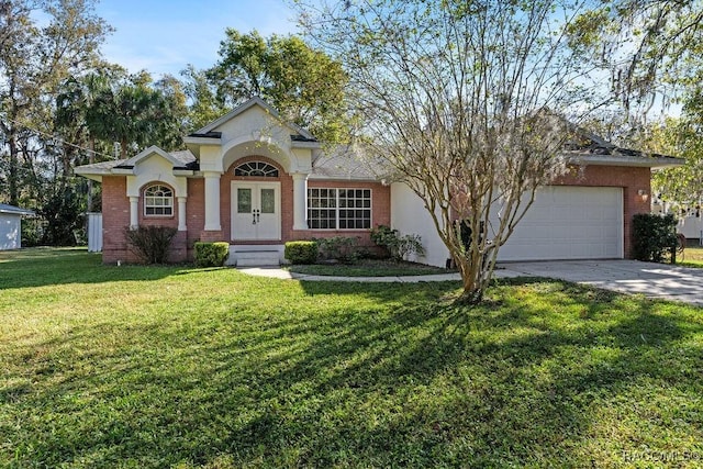 view of front of property featuring french doors, brick siding, and concrete driveway