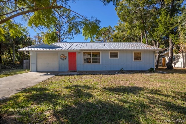 single story home with a garage and a front yard