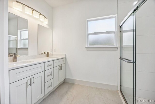 7820 N Sarazen Dr, Citrus Springs, FL 34434 - bathroom with marble finish flooring, a shower stall, double vanity, and baseboards