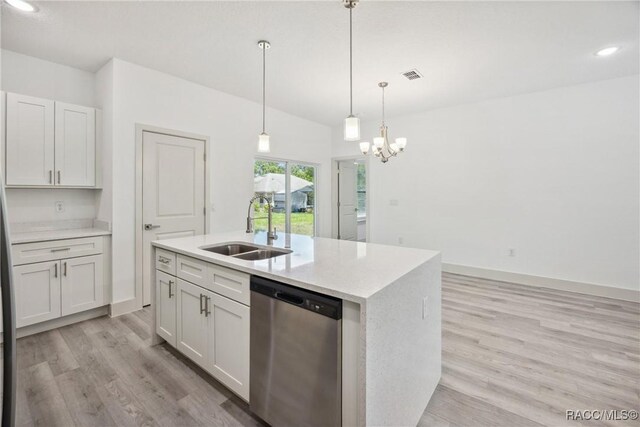 7820 N Sarazen Dr, Citrus Springs, FL 34434 - kitchen featuring stainless steel dishwasher, a sink, light wood-style floors, hanging light fixtures, and recessed lighting