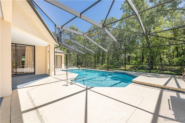outdoor pool with a patio and a lanai