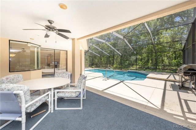 pool with a ceiling fan, grilling area, a patio, a lanai, and outdoor dining area