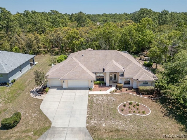 aerial view featuring a wooded view