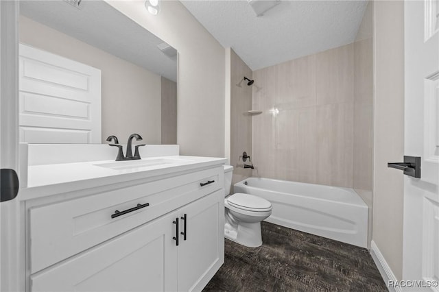 full bathroom featuring toilet, a textured ceiling, vanity, shower / bath combination, and hardwood / wood-style floors