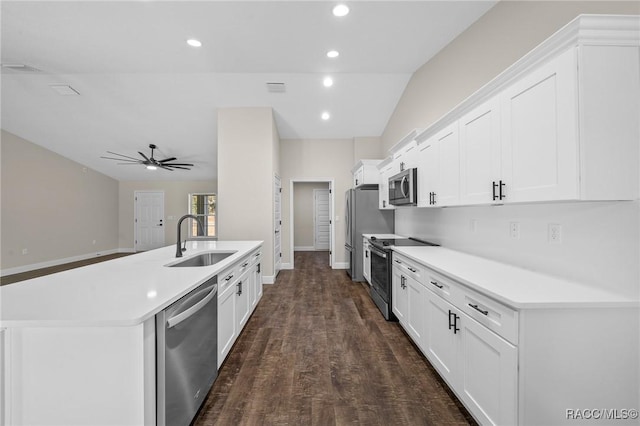 kitchen with white cabinetry, stainless steel appliances, dark hardwood / wood-style floors, and sink